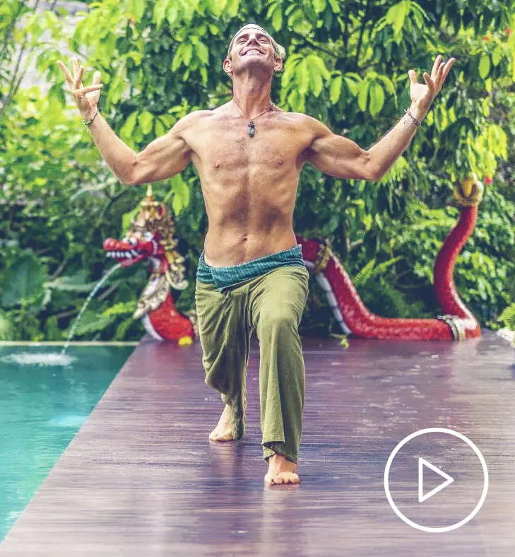 Yoga instructor practising beside a pool in Bali
